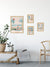 Carte postale Lacanau Le Vélo en mise en scène murale avec d'autres illustrations aux tons pastel.