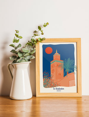 Carte postale illustrée intitulée “Marrakech, La Koutoubia” par Julie Roubergue, représentant le fameux minaret dans les tons ocres et bleus.